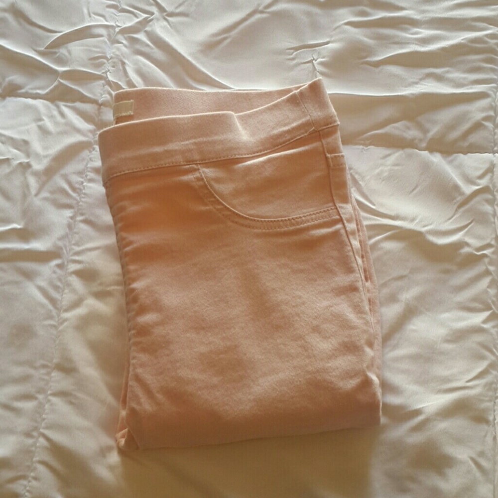 Baby pink skinny jeans
